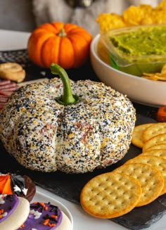 an assortment of snacks including crackers and pumpkins