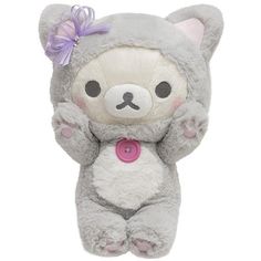 a stuffed animal with a pink tag on it's chest and arms in the air