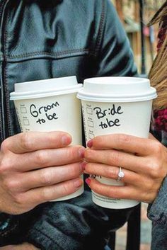 two people holding coffee cups with the words bride and groom written on them in cursive writing