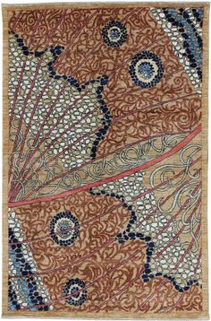 an intricately designed rug with blue and red accents on the bottom, in brown tones