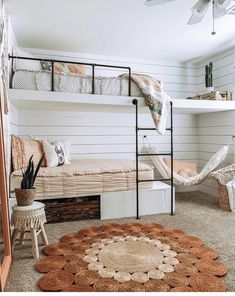 a bedroom with bunk beds and hammock chairs