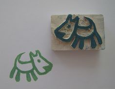 a stamp with a horse on it next to a rubber stamp that has the shape of a dog's head