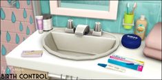 a bathroom sink with toothbrushes, shampoos and other items