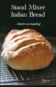 a close up of a bread on a rack with the words stand mixer italian bread there's no breading