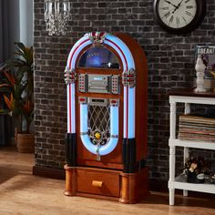 an old - fashioned jukebox sits in front of a brick wall and clock