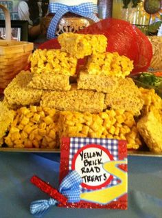 there are many treats on the table and one has a sign that says, yellow milk ramen treat's