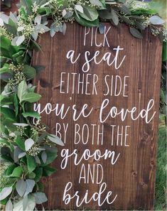 a wooden sign that says pick a seat either side you're loved by both the groom and bride