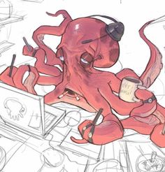 an octopus sitting on top of a laptop computer next to a coffee cup and pencils