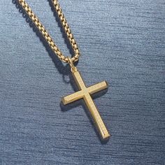 Wear your faith proudly with this men's cross necklace. This beautiful statement piece is crafted in sterling silver with 14k yellow gold plating and sits on a sturdy 24-inch gold plated stainless steel chain. The Paved Cubic Zirconia stone cross necklace for him showcases your faith and belief. It adds protection and a unique look to your wardrobe. Discover all our sleek 925 silver jewelry for men and find a gift for him HERE Made with yellow gold plated 925 sterling silver. Color: Yellow Plain Gold Spiritual Cross Necklace In Stainless Steel, Gold Stainless Steel Spiritual Cross Necklace, Spiritual Cross Jewelry For Father's Day, Gold Stainless Steel Crucifix Jewelry, Gold Cross Necklace For Father's Day, Silver Jewelry For Men, Necklace For Him, Stone Cross, Mens Cross Necklace