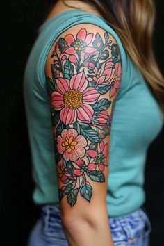 a woman with a flower tattoo on her arm