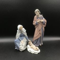 two figurines of the nativity scene are shown