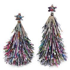 two christmas trees made out of magazines are shown in front of each other on white background