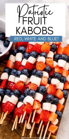 red, white and blue fruit kabobs on skewers with text overlay