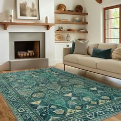 a living room filled with furniture and a fire place in the middle of the room