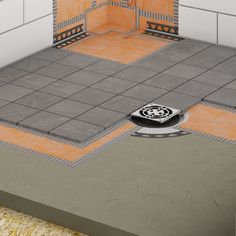 a floor drain in the middle of a bathroom with orange and gray tiles on it