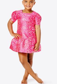 Your mini will delight in dressing up when she wears our festive Erina Dress. Made from golden floral brocade, this drop waist dress is finished with puff sIeeves.  ﻿﻿Short, poof sleeve, drop waist dress with a scooped neckline and back zipper. ﻿﻿Enjoy an extra 3/4" of hem flexibility with this style. Wear as-is or let it out for some extra length. ﻿﻿Gold Puff Floral Brocade (63% Polyester, 20% Metallic, 17% Nylon). ﻿﻿Hand wash cold, separately, or dry clean. ﻿﻿Imported. Spring Princess Style Puff Sleeve Party Dress, Princess Puff Sleeve Dress For Dress-up, Fitted Princess Style Puff Sleeve Dresses, Pink Dresses With Ruffle Hem And Fitted Bodice, Fitted Dress For Spring Pageant, Fitted Spring Dress For Pageants, Spring Princess Bubble Dress With Ruffles, Spring Princess Style Bubble Dress With Ruffles, Spring Princess Puff Sleeve Dress With Ruffles