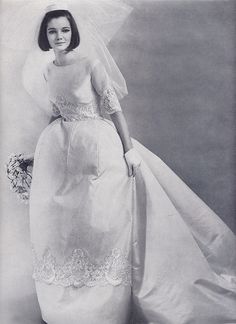 an old photo of a woman in a wedding dress