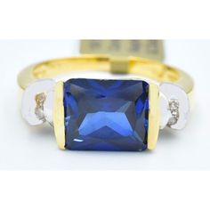 Metal Purity: 10k Yellow Gold Condition: New With Tag Gemstone Type: 1 Genuine Blue Sapphire 3.86 Carats Blue Sapphire Grades, Hue . . .Blue Tone . . . Medium Dark Saturation . . . Vivid Cut . . . Very Good No Inclusions 4 Genuine Diamonds - 0.015 Carats Each Diamond Grades, Clarity Grade . . I1 Color Grade . . . Ij Ring Size: 7 (Resizing Service Available If Needed) Dimensions: 10 Mm X 8 Mm - Gemstone Measurements Certificate Appraisal Available If Interested 14k Gold Baguette Cut Blue Sapphire Ring, Blue Tanzanite Rings With Diamond Accents, Blue Sapphire Ring With Diamond Accents, Baguette Cut, Blue 14k Gold Ring With Baguette Cut, 14k Gold Baguette Cut Blue Ring, Classic Blue Diamond Ring Hallmarked, Blue Diamond Ring In 14k Gold, Blue Diamond Ring With Baguette Cut And Accent Stones, Blue Baguette Cut Cubic Zirconia Rings