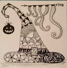 a black and white drawing of a hat with halloween decorations on it's side