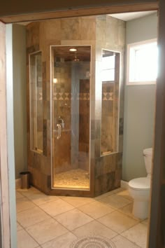 a walk in shower sitting inside of a bathroom