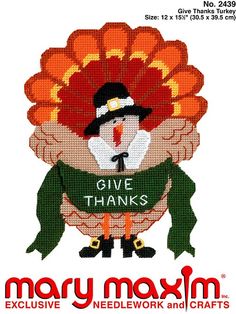 a cross stitch thanksgiving card with a turkey wearing a pilgrim hat and holding a sign that says give thanks