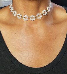 Whether you're attending a special occasion or simply want to feel fabulous, our Floral Pearl Choker is the perfect accessory to make a statement and leave a lasting impression. Embrace your inner charm and let this enchanting piece adorn your neck with sheer elegance. Chic Metal Jewelry For Wedding, Chic Wedding Clavicle Chain Jewelry, Chic Wedding Jewelry In Metal, Chic Metal Wedding Jewelry, Trendy Summer Party Jewelry, White Rhinestone Clavicle Necklace For Weddings, Elegant Rhinestone Necklace For Celebrations, White Bridal Necklace With Clavicle Chain For Party, Round Pearl Chain Necklace For Parties