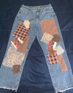 Western-inspired patchwork jeans. Fun and trendy! Fit: Straight leg, mom jeans. Worn jeans that have been refurbished to a unique new style! Fall Patchwork Straight Leg Jeans, Fall Denim Bottoms With Patches, Fall Denim Jeans With Patches, Denim Jeans With Patches For Fall, Denim Blue Patchwork Jeans For Fall, Straight Leg Bottoms With Patches For Fall, Casual Straight Leg Jeans With Collage Stitching, Fall Patchwork Denim Blue Jeans, Fall Straight Leg Bottoms With Patches