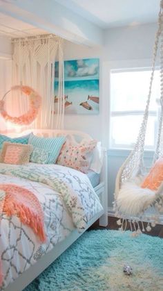 a bedroom with a hammock hanging from the ceiling and pillows on the bed