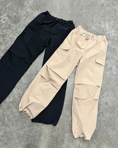 Designed to fit you perfectly, these pants boast a sleek and comfortable silhouette. The unique feature of a toggle waist drawstring ensures a personalized fit, offering maximum ease and style. Style with our 'Valeria Tank Crop Top' for a simple, yet chic look. More Details: - Fits true to size for most - Does stretch - Baggy fit - Two pockets - Back faux pockets - Color may vary due to the lighting - Model is wearing a size small Model Details Height 5'5 | Chest 32" Cup size A | Waist 25" Hips Cute Cheap Zara Bottoms, Cheap Zara Bottoms With Side Pockets, Baggy Pants With Crop Top, Reggaeton Dance, Tapestry Corset, Parachute Cargo Pants, Parachute Cargo, Cocktail Outfit, Desi Fashion Casual