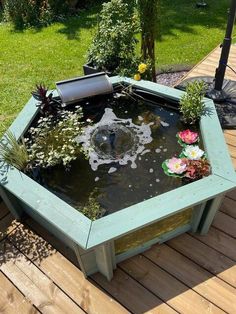 a small pond in the middle of a wooden deck