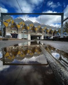 a reflection of buildings in the water