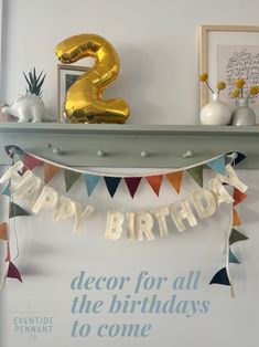 a birthday banner with the number two on it and decorations in front of it that reads, decor for all the holidays to come