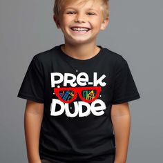 Get your little one ready for their first day of Pre-K in style with our Pre-K Dude shirt! This back to school tee is perfect for both boys and girls and features a fun and vibrant design that will make your child stand out on their special day. Our Pre-K Dude shirt is designed with the needs of busy parents in mind. It's easy to care for and can be machine washed and dried, making laundry day a breeze. This Kids Boy Girl back to school Tee is not only stylish, but it also serves as a great conv Playful T-shirt For Back To School, Casual Tops For Back To School Playtime, Casual Tops For Back To School, Playful Back To School T-shirt, Cotton T-shirt For End Of School Year Playtime, Playful Back-to-school T-shirt For Playtime, End Of School Year Graphic Print T-shirt For Playtime, End Of School Year Playtime Cotton T-shirt, Casual Tops For Birthday And Back To School