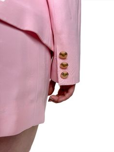 Even Cher Horowitz would be proud to strut in this baby pink vintage 90s suit by Clairvoyant. Complete with a mini pencil skirt, butterfly collared blazer, and unique ivory and silver buttons. The blazer is darted up the front and along the back to flatter your figure. Don't be clueless, you need this for your first day! Made in USA. Product Measurements: See the Measurement Guide in the photo carousel. Top Shoulder: 14.5" Chest: 36" Waist: 26" Sleeve Length: 21" Blazer Entire Length: 25" Skirt Pink Party Blazer With Button Closure, Chic Spring Skirt Suit With Buttons, Spring Notch Lapel Skirt Suit For Party, Fitted Pink Blazer Dress For Office, Pink Blazer With Button Closure For Formal Occasions, Pink Formal Blazer With Button Closure, Spring Fitted Skirt Suit With Button Closure, Spring Pink Fitted Blazer Dress, Pink Fitted Blazer Dress For Spring