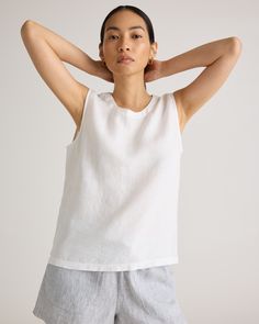 An all-year essential. This linen tank top is made from soft, textured 100% organic linen. It's perfect to layer under a cardigan or does just as well on its own on those warmer days. Especially with the matching linen pants.  | Quince | Women's Tank Top in White, Size Large, Linen Casual Linen Tank Top For Everyday, Casual Everyday Linen Tank Top, Everyday Linen Tank Top, Minimalist Summer Tank Top For Everyday, Spring White Linen Tank Top, Spring Linen Tops For Everyday Wear, Versatile Linen Top For Everyday, White Linen Tank Top For Spring, Everyday Linen Tops For Spring