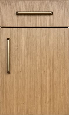 a wooden cabinet with brass handles and knobs