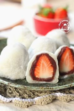 some food on a plate with strawberries in the background