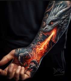 a man's arm with a dragon on it and flames coming out of his hand