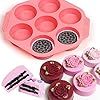 an ice cream tray with cupcakes in it next to some tools and spoons