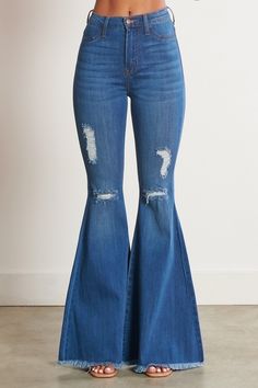 Don't just rock the concert scene - own it! These Lainey Concert Bell Bottom Jeans reign the fashion kingdom with iconic old school bell bottoms and just-right blue denim. Look cool and feel comfy in these edgy jeans made for concert outfits that stand out from the crowd. Ready to rock? Go for it! A pair of exaggerated, high-rise flare jeans featuring a front whiskered wash, open distressed knee detail, classic 5-pocket construction, frayed raw hem, and a zip-fly closure. (3) Rise: 11" Inseam: 3 Edgy Jeans, Distressed Flare Jeans, Rush Dresses, Bodycon Fashion, Complete Outfits, Premium Denim, High Rise Jeans, Outfits Casuales, Denim Fabric