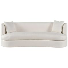 a white couch with two pillows on it