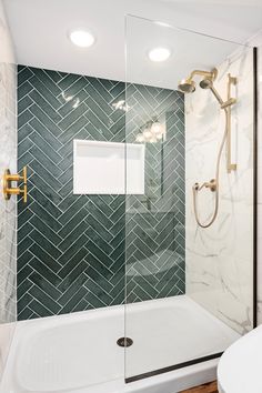 a white tub sitting next to a walk in shower