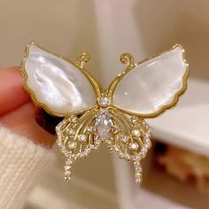 Stunning Golden Butterfly Brooch With Luxurious Mother-Of-Pearl Wings And Sparkling Crystal Accents. This Elegant And Timeless Accessory Adds A Touch Of Vintage Glamour To Any Outfit. Perfect For Weddings, Formal Events, Or As A Statement Piece On A Casual Day. Its Intricate Design And High-Quality Finish Make It A Must-Have For Any Fashion-Forward Wardrobe. Secure Pin Back Ensures It Stays In Place On Jackets, Scarves, And Dresses. Elevate Your Style With This Unique And Elegant Butterfly Brooc Lapel Pins Wedding, Brooch Corsage, Butterfly Gifts, Fancy Gifts, Engagement Party Wedding, Wedding Party Jewelry, Butterfly Brooch, Butterfly Shape, Pearl Brooch