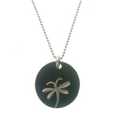 a black and silver necklace with a dragonfly on it