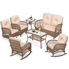 an outdoor furniture set with beige cushions