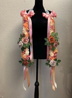 a black mannequin with flowers and ribbons on it