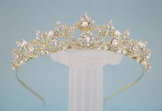 "Gold Bridal Tiara, Wedding Tiara, Gold Bridal Crown, Gold Leaf Crown, Rhinestone Crown, Bride Tiara, Gold Tiara This elegant and sparkle rhinestone Tiaras is perfect for your wedding or formal night out. This Tiaras is flexible. It will be perfect for the bride. The Metal Headband measured approx. 14\" long. The rhinestone part of the headband is about 7.25\" long and the center is 1.5\" high. Tone color: Silver tone, Gold tone and Rose gold tone. Pearl color : Swarovski white pearl and Ivory p Simple Tiara, Gold Bridal Crown, Gold Bridal Tiara, Gold Leaf Crown, Gold Bridal Crowns, Crown Bride, Tiara Gold, Rose Gold Tiara, Crown Silver