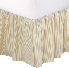 the bed skirt is made with ticking fabric