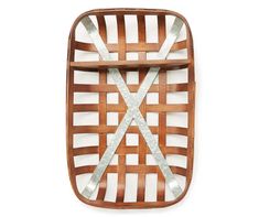 a wooden basket with metal straps on the front and sides, against a white background