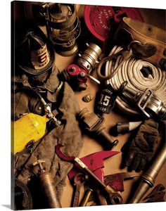 there are many different types of tools on the table together, including fire extinguishers